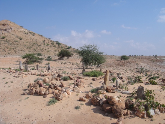 Graveyard next to bombed out Somali tank